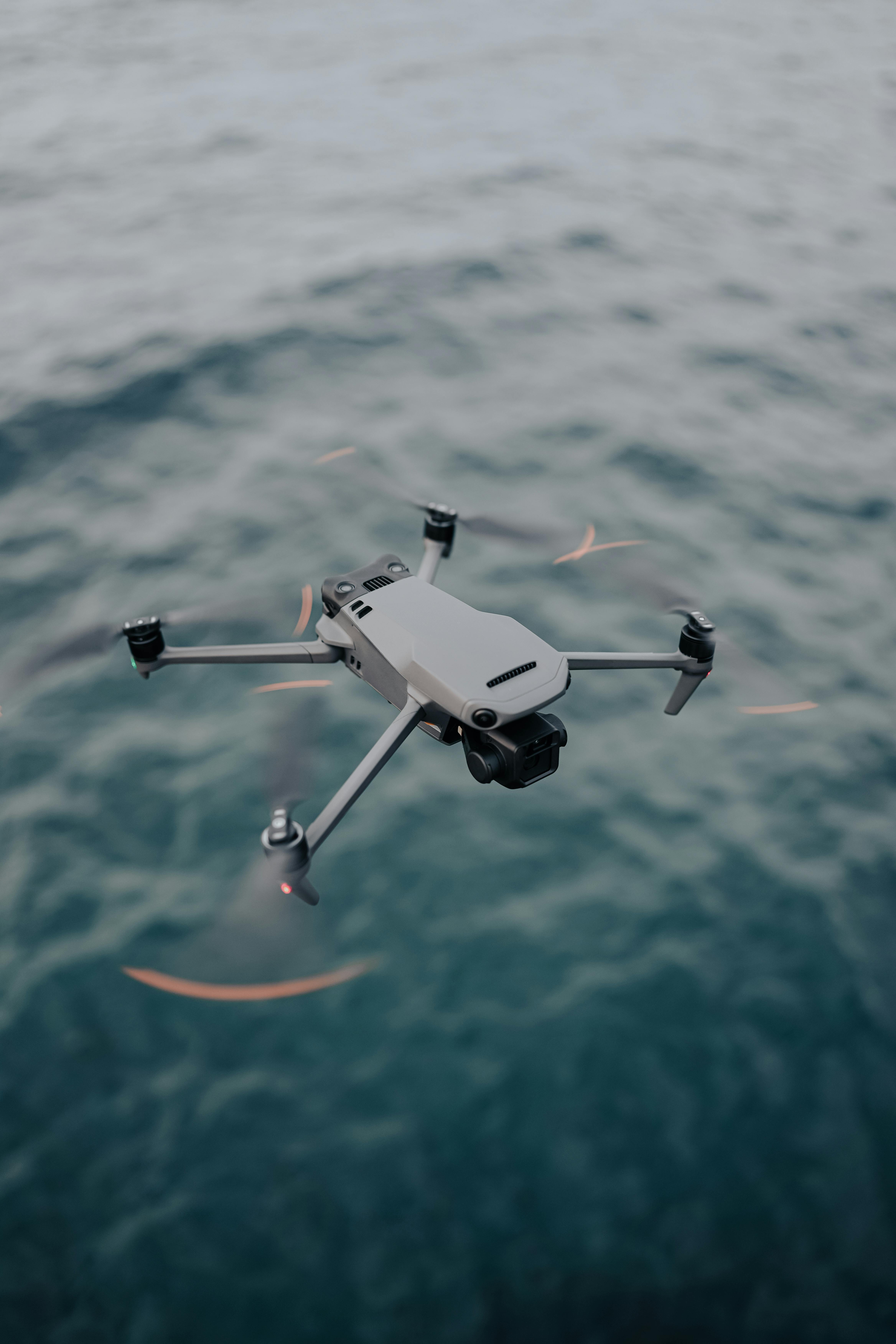 HaytHive drone in active flight over open water