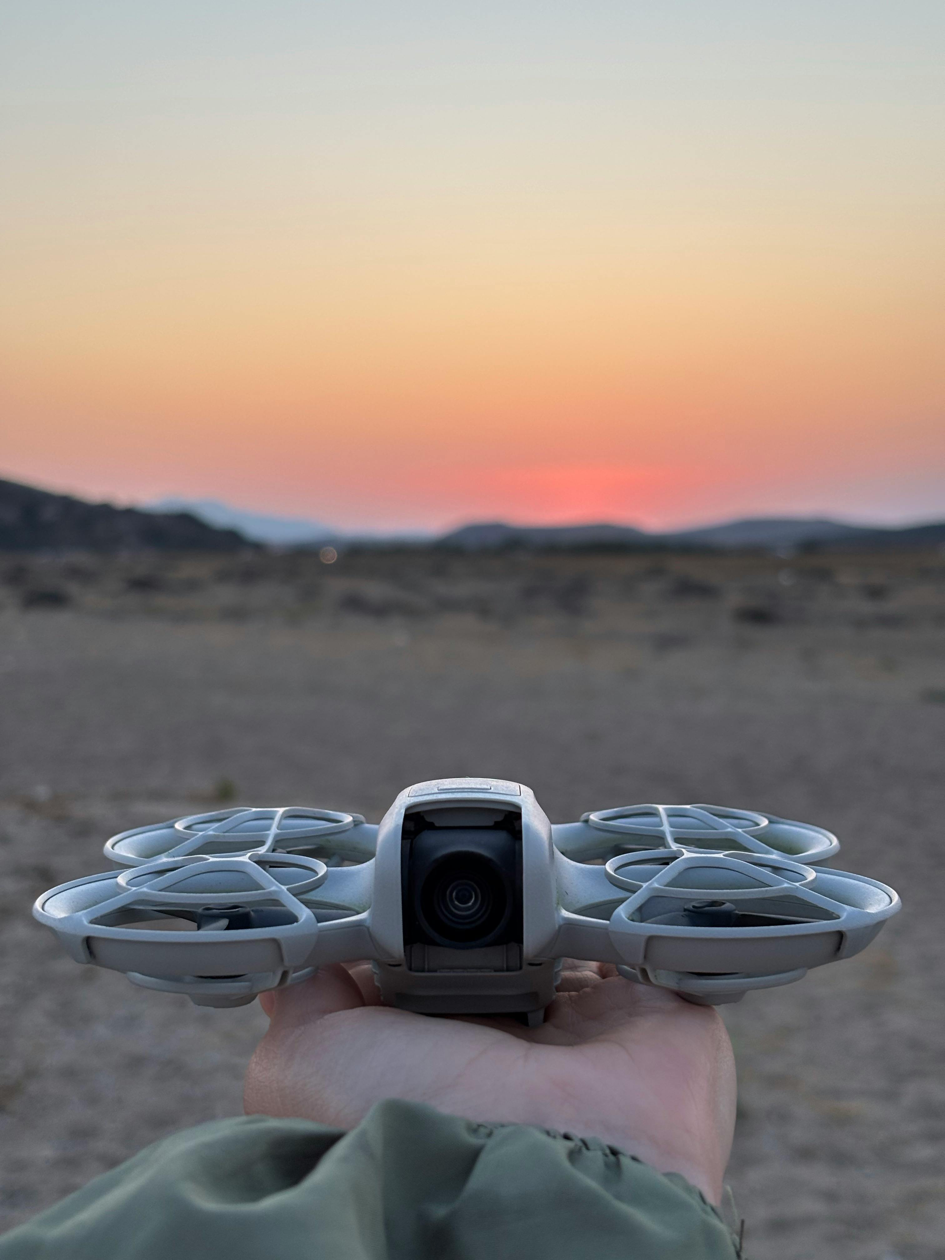 HaytHive Proof of Concept drone held up at desert sunset